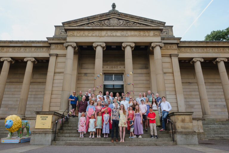 Group photo at a wedding celebration at Weston Park Museum, Sheffield